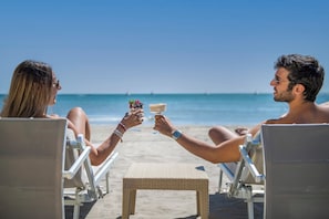 Private beach nearby, beach umbrellas, beach towels, beach bar