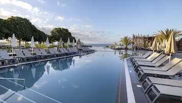 7 outdoor pools, open 10:00 AM to 6:00 PM, pool umbrellas, sun loungers