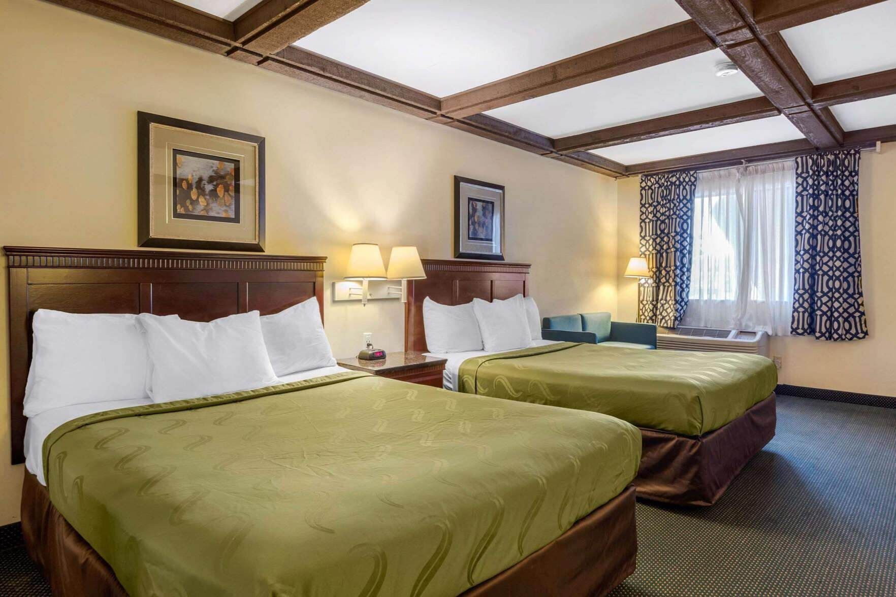 Premium bedding, desk, laptop workspace, blackout curtains
