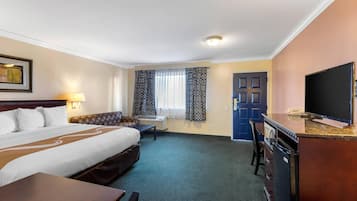 Premium bedding, desk, laptop workspace, blackout drapes