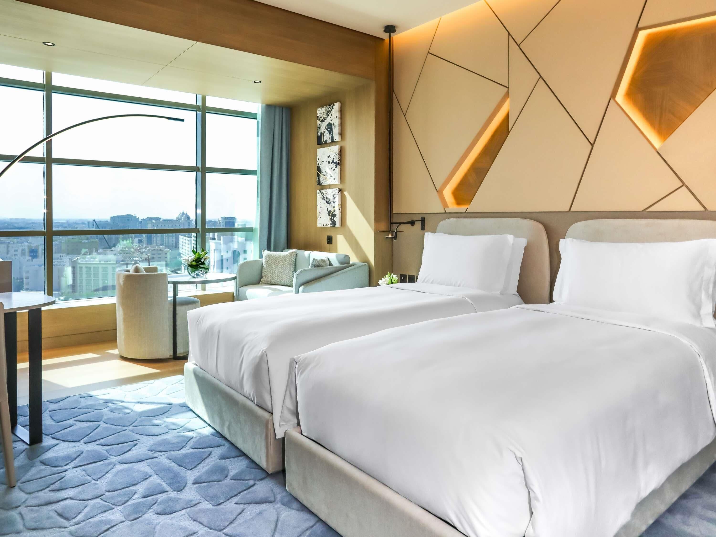 Premium bedding, down comforters, minibar, in-room safe