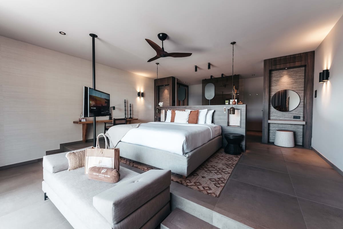 Suite, 1 King Bed, Beachfront | 2 bedrooms, minibar, in-room safe, desk