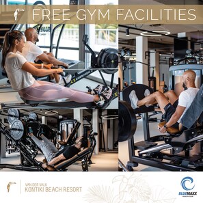 A gym with rowing machines, weightlifting equipment, and a variety of fitness machines.