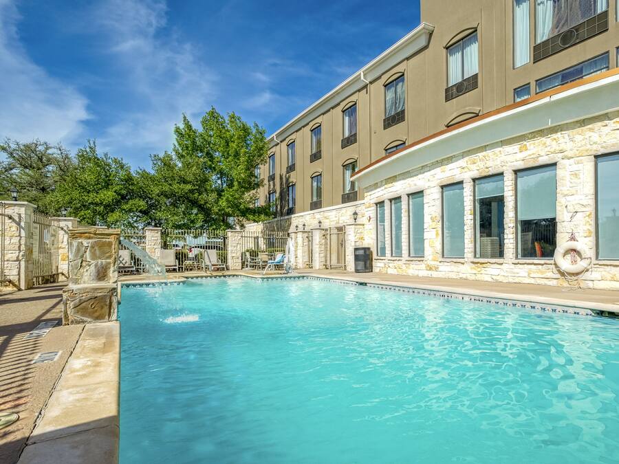 Seasonal outdoor pool, open 10:00 AM to 10:00 PM, pool umbrellas