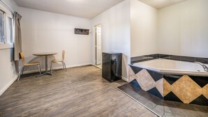 A modern bathroom with a bathtub, a shower, and a toilet. - Motel 6 Toms River, NJ - Near Seaside Heights (Toms River)