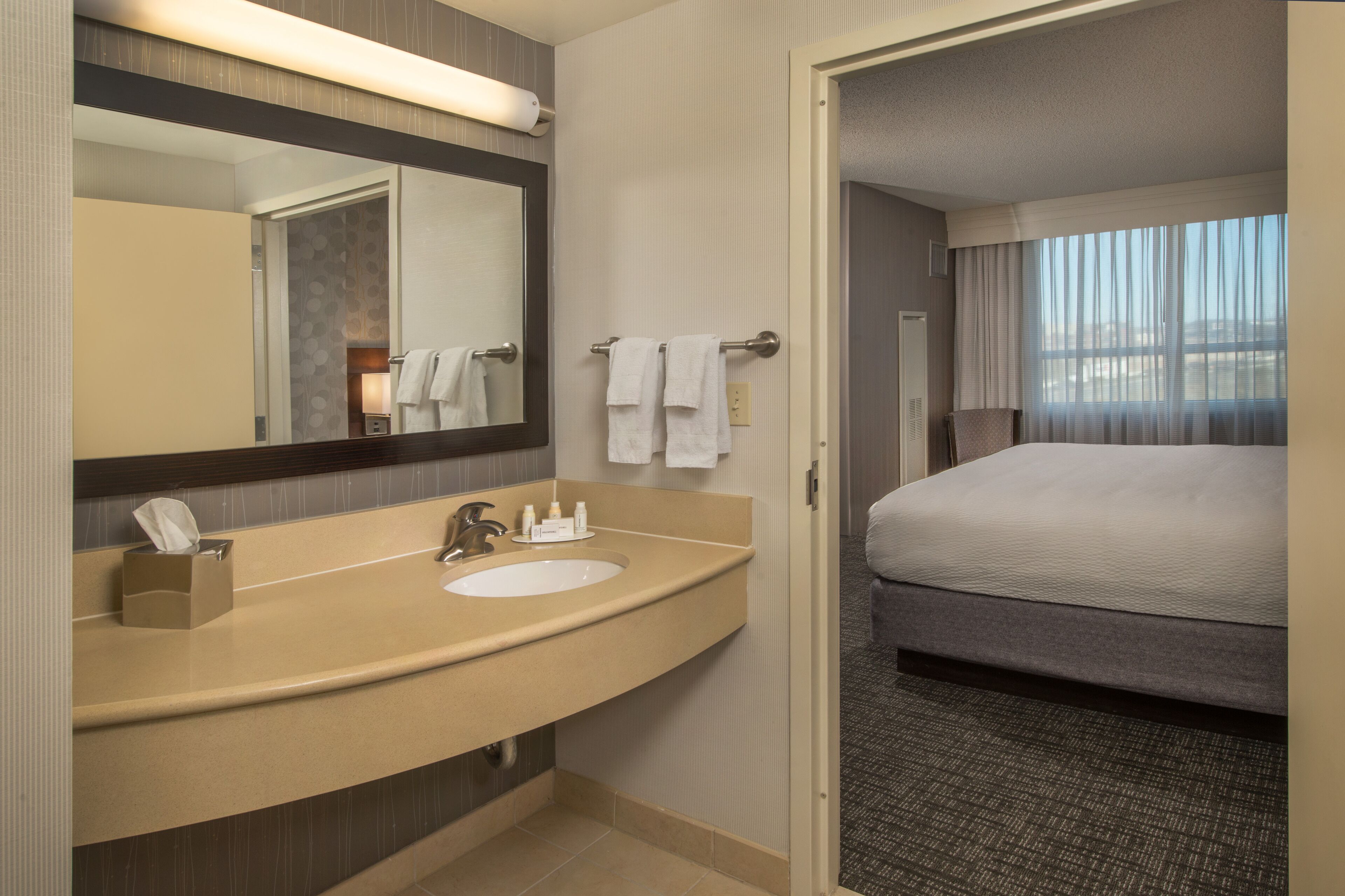 Combined shower/tub, designer toiletries, hair dryer, towels