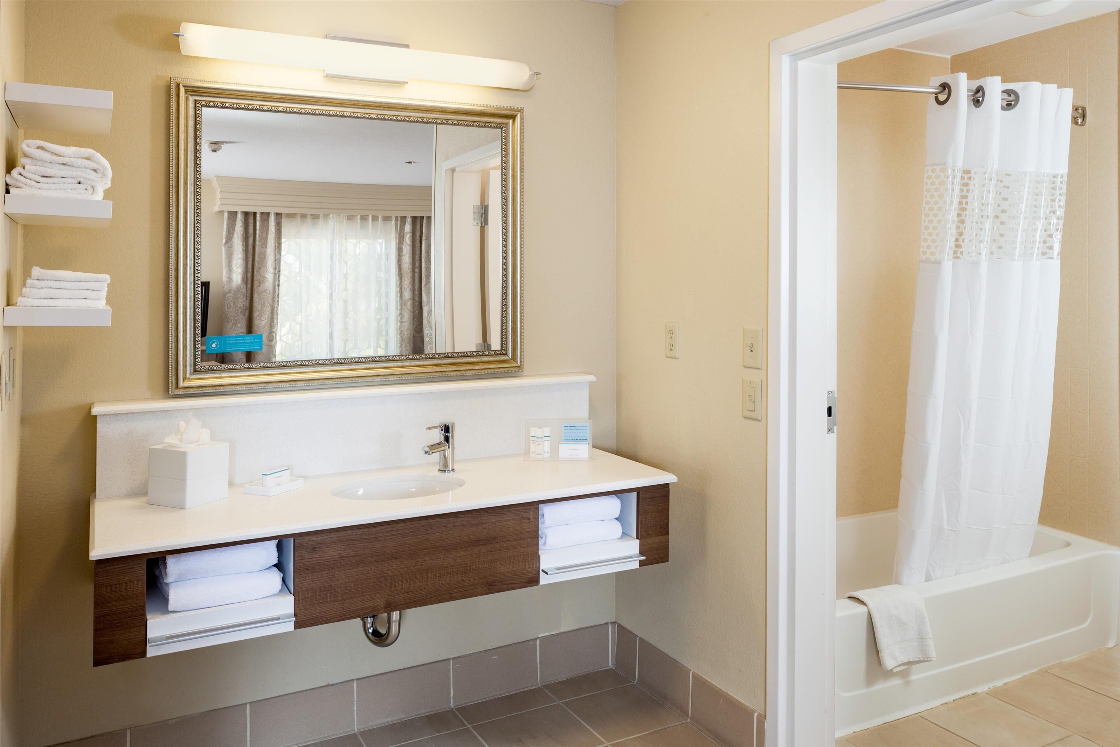 king bed | bathroom | shower, free toiletries, hair dryer, towels