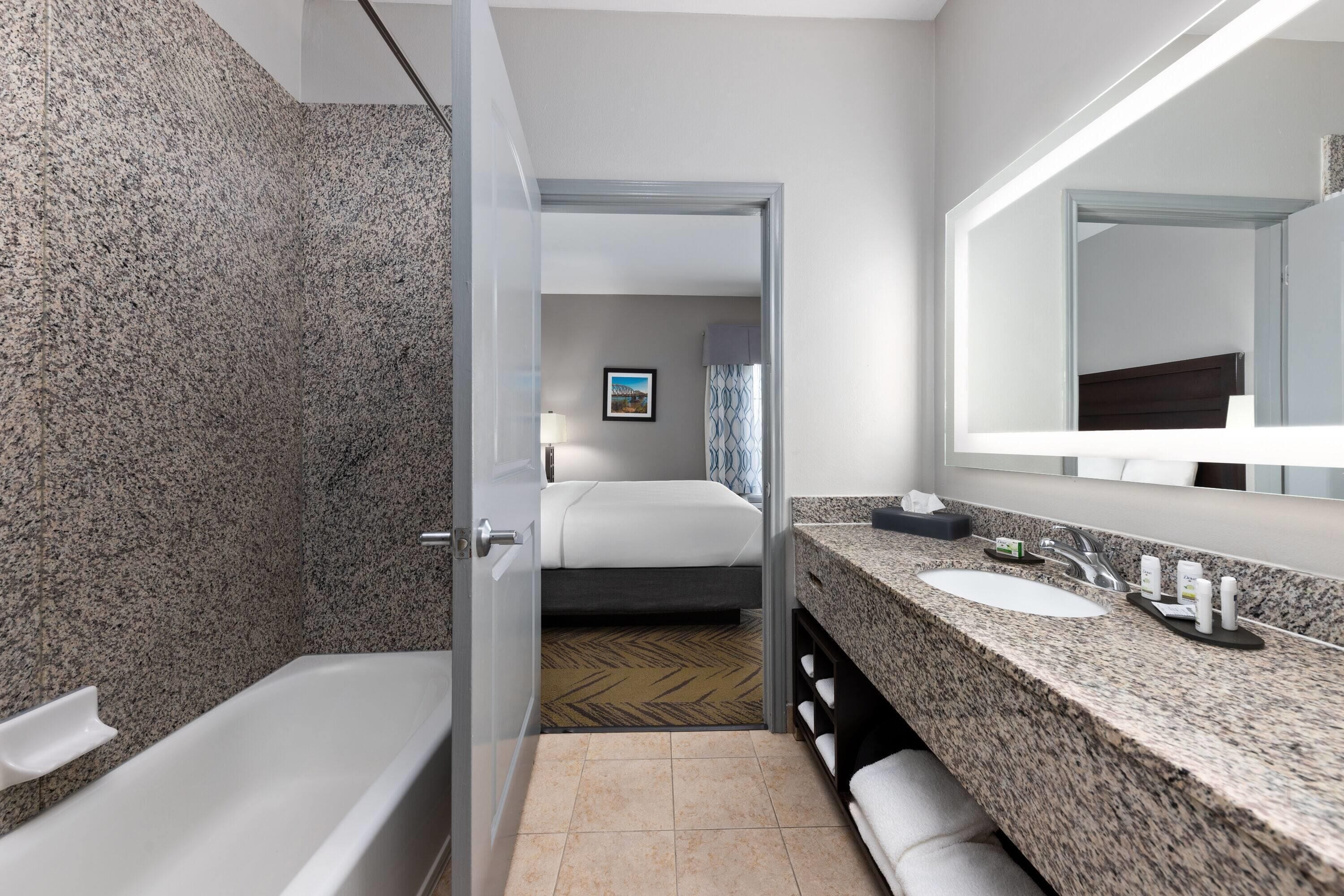 Deluxe Apartment, 1 King Bed, Non Smoking (Executive) | Bathroom | Combined shower/tub, hair dryer, towels, soap