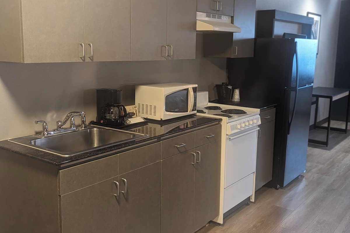 apartment, 1 king bed, non smoking | premium bedding, desk, laptop workspace, blackout curtains