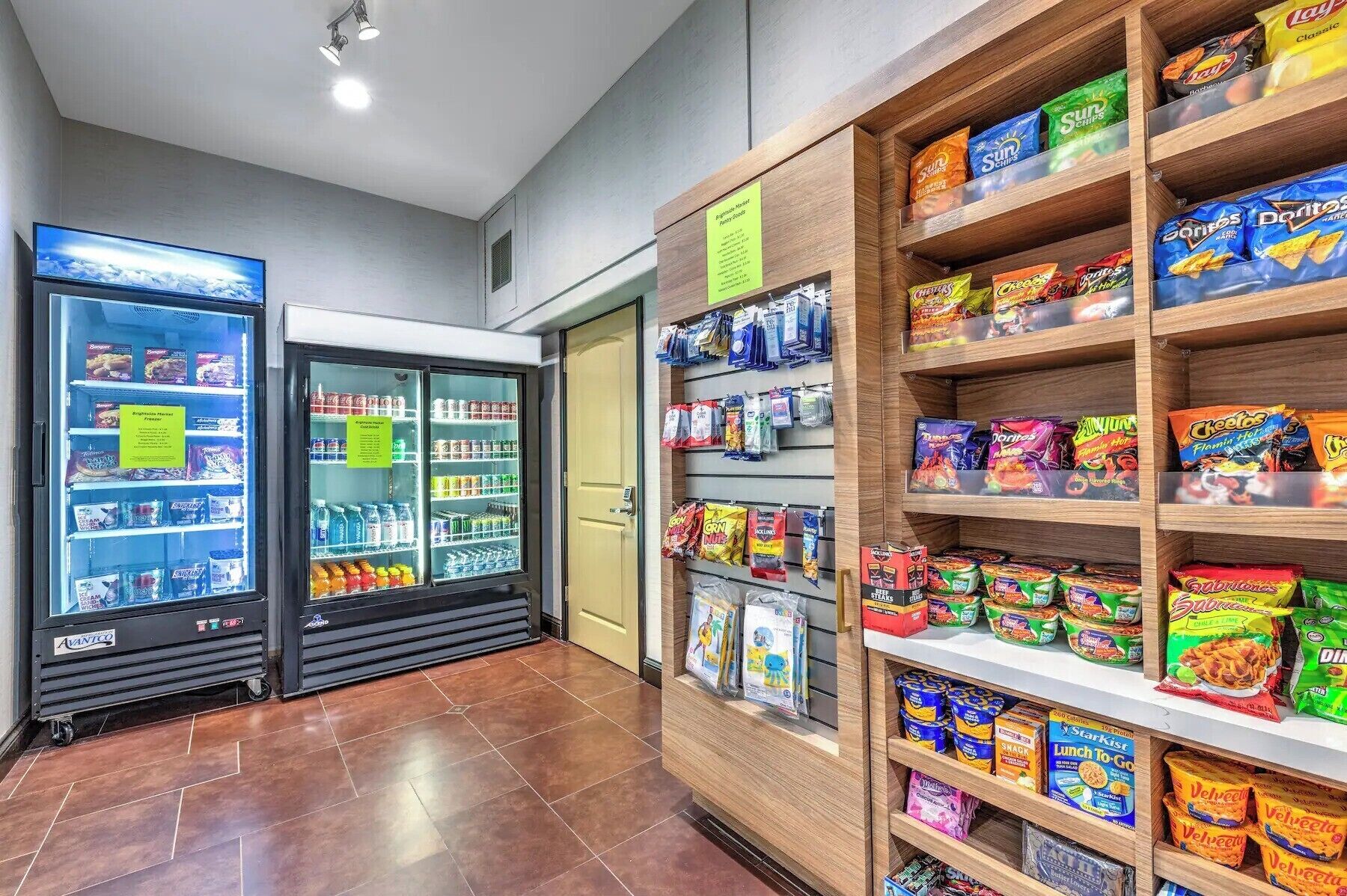 A snack and beverage section with refrigerated drinks, snacks, and packaged foods.