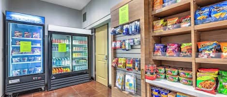 A snack and beverage section with refrigerated drinks, snacks, and packaged foods.
