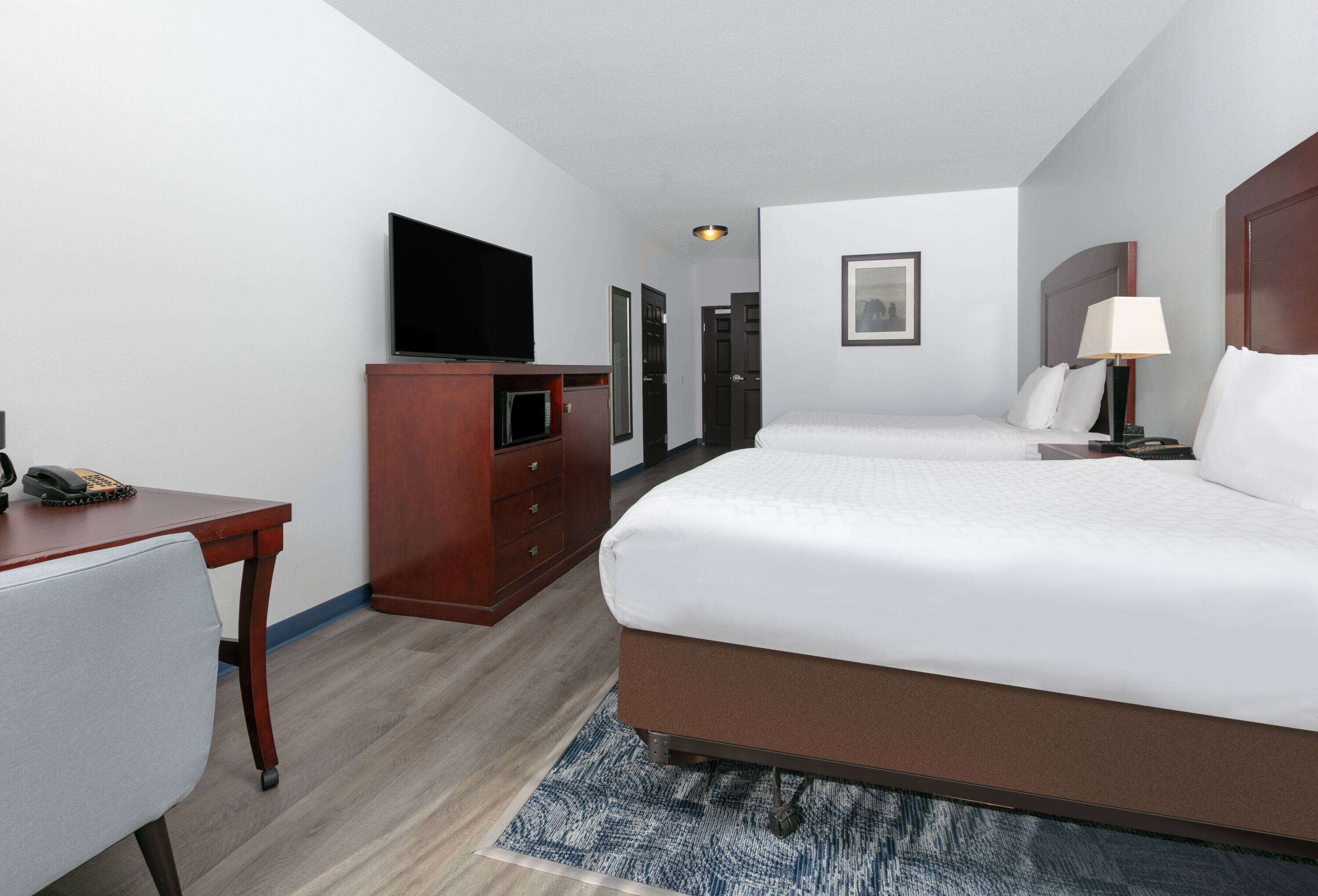 Premium bedding, desk, laptop workspace, iron/ironing board