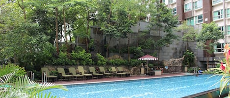 Seasonal outdoor pool, pool loungers