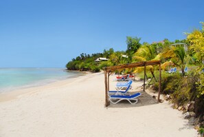 On the beach, white sand, free beach cabanas, sun-loungers
