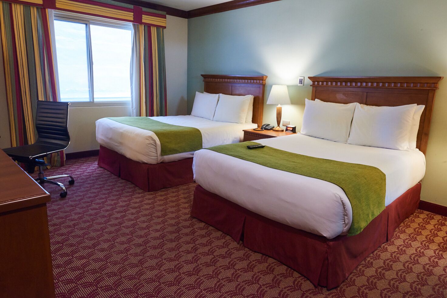 quadruple room | pillow-top beds, minibar, in-room safe, desk