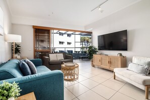 2 Bedroom Pool Entry - Poolside Tower | Living area | 50-inch TV with satellite channels