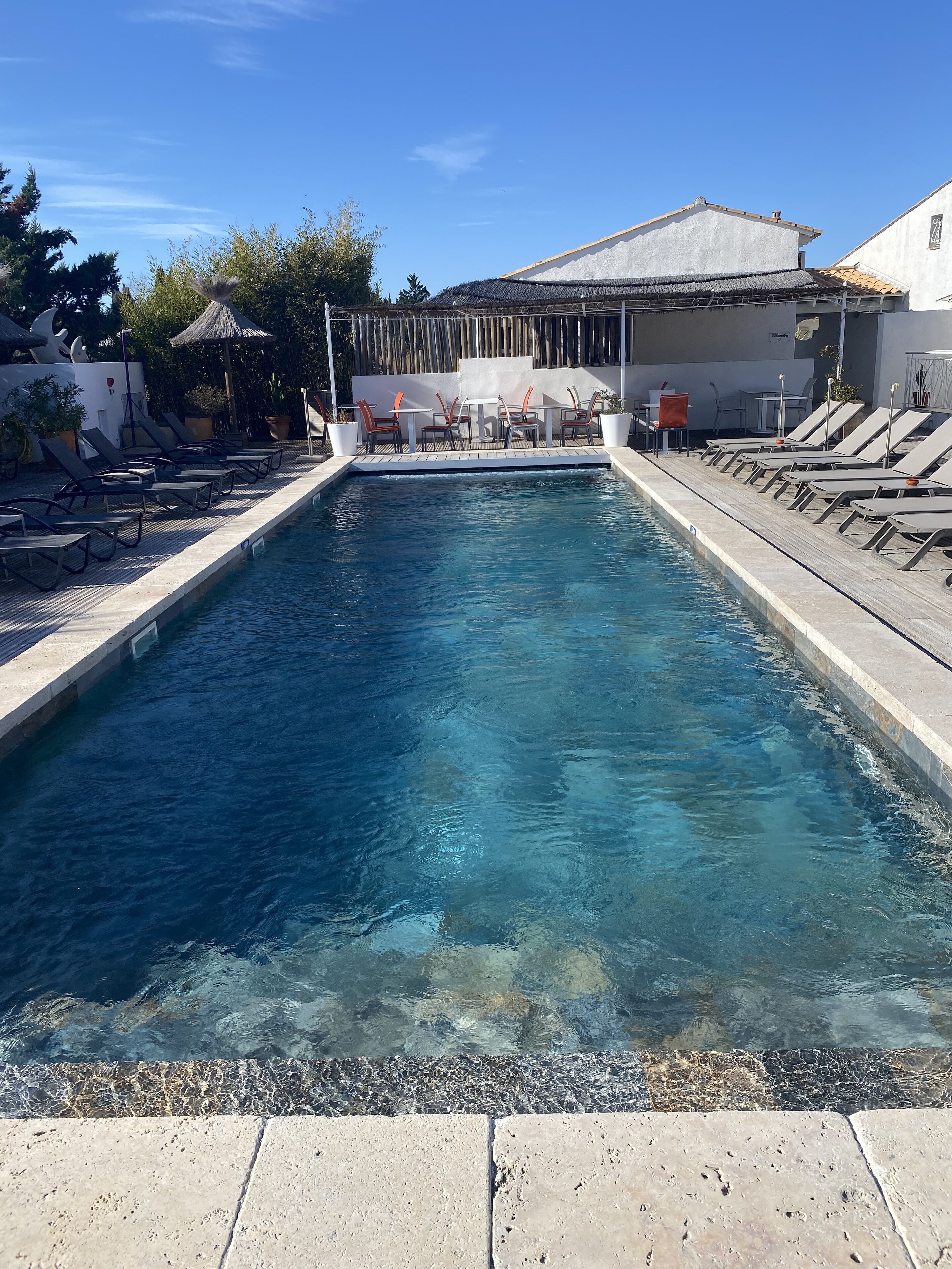 outdoor pool, open 10:00 am to 9:00 pm, pool loungers