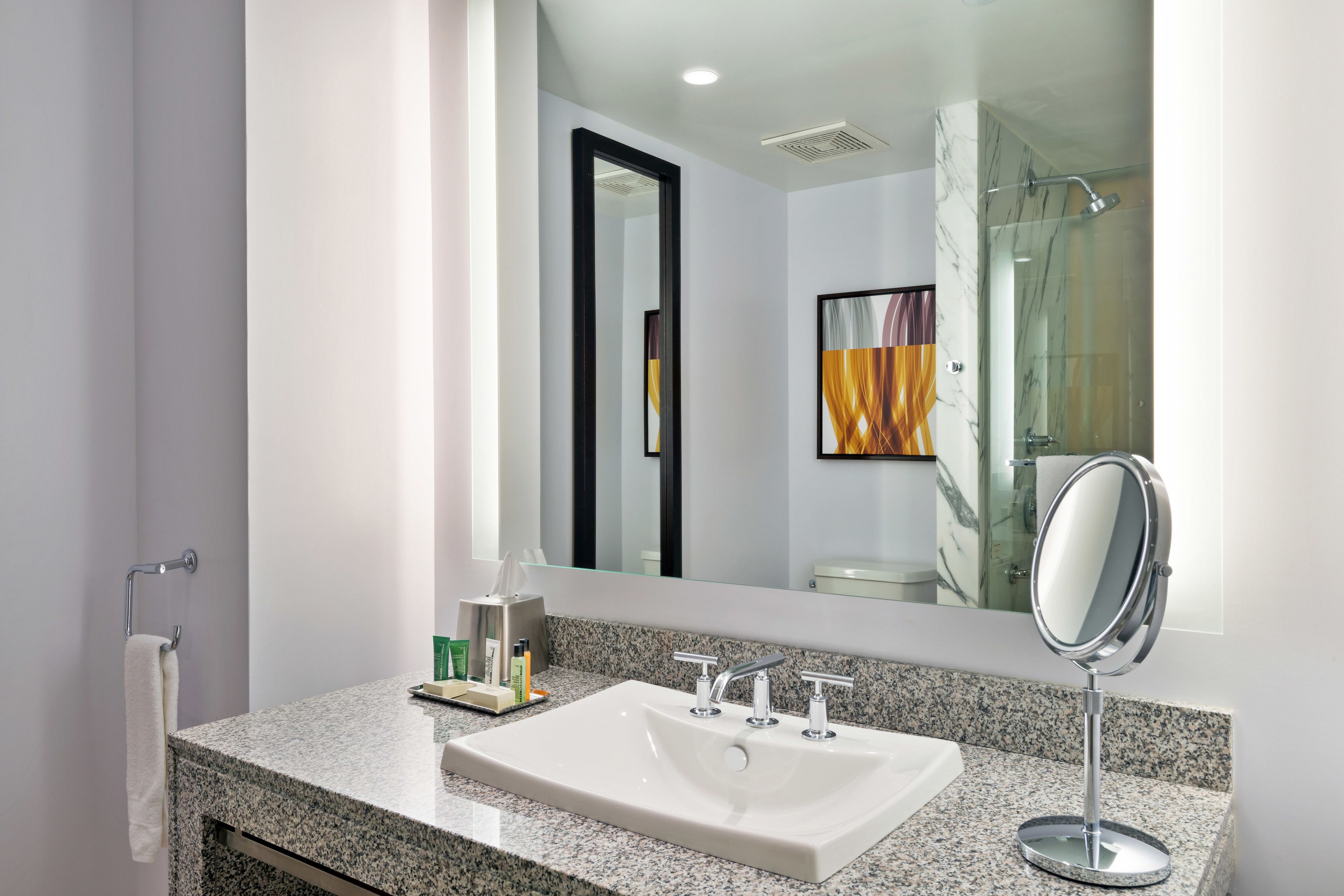 Designer toiletries, hair dryer, towels