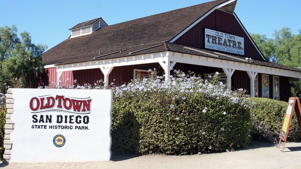 A historic building with a sign that reads "Old Town San Diego State Historic Park."