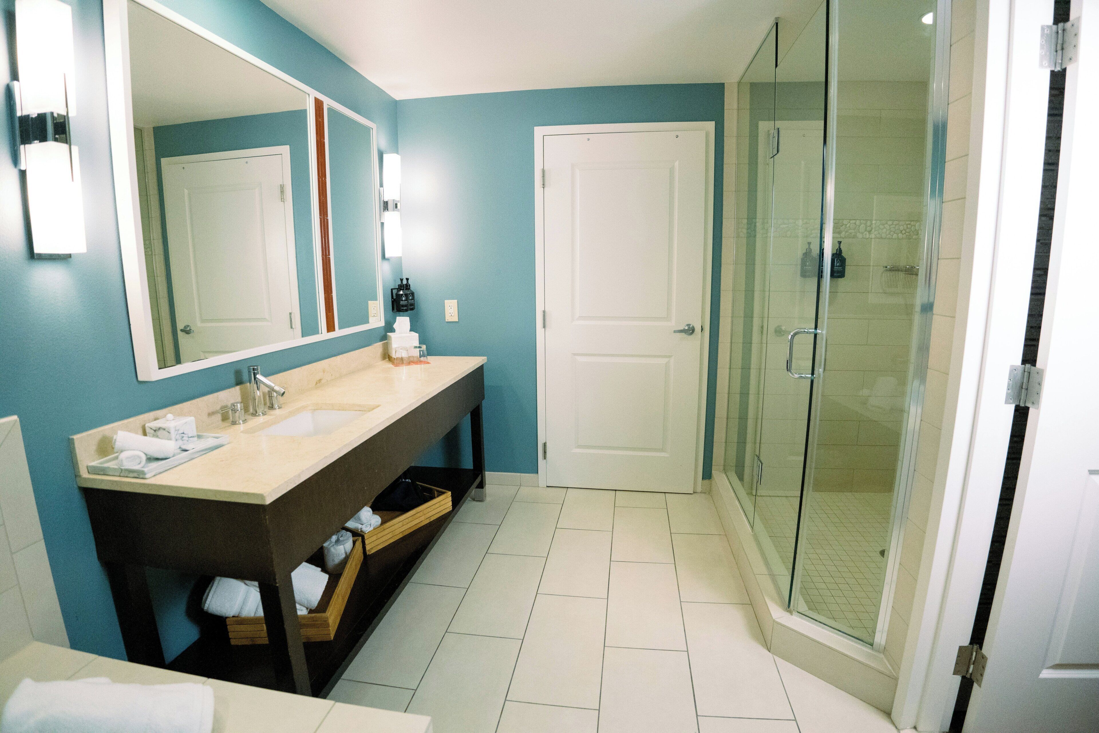 Shower, rainfall showerhead, designer toiletries, hair dryer
