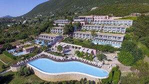 A resort with multiple buildings, a large swimming pool, and lush greenery. - Ionian Blue Bungalows And Spa Resort (Lefkada)