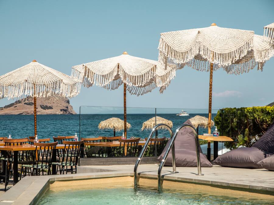Seasonal outdoor pool, open 9:30 AM to 11:30 PM, pool umbrellas