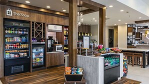 A modern retail space with a chilled and frozen section, a coffee station, and a snack bar. - Hilton Garden Inn Tifton (Tifton)