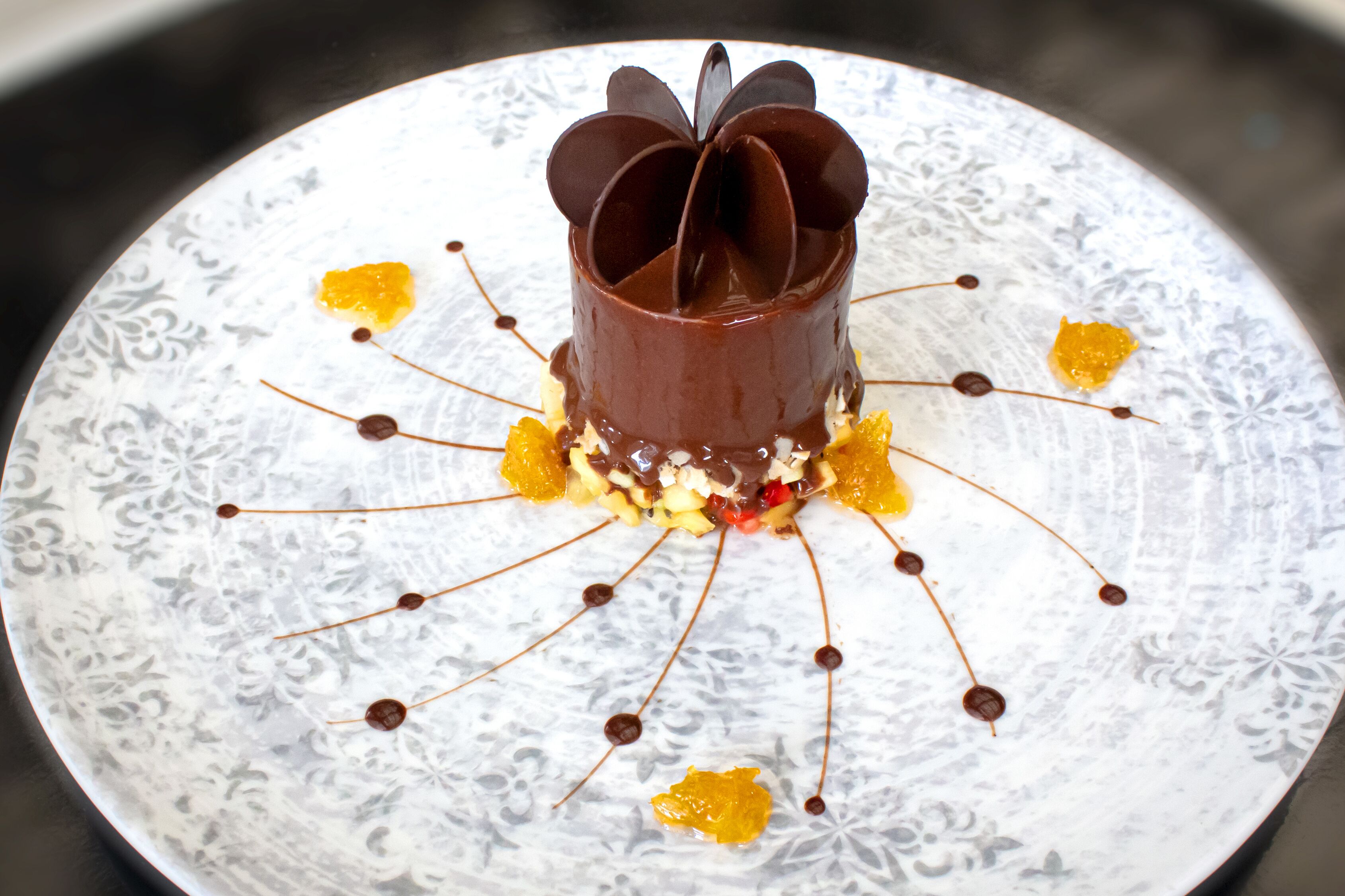 A dessert on a plate with a floral pattern.