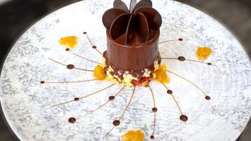 A dessert on a plate with a floral pattern.