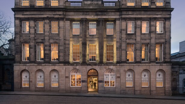 A historic building with large windows and arched doorways, likely a hotel or public building. - Princes Street Suites (Edinburgh)