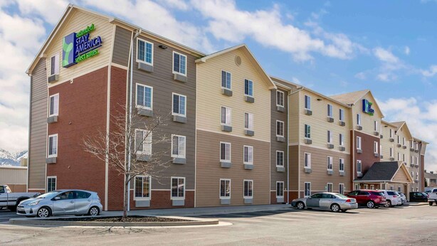 A multi-story hotel with a sign for Extended Stay America select suites. - Extended Stay America Select Suites - Ogden (Ogden)