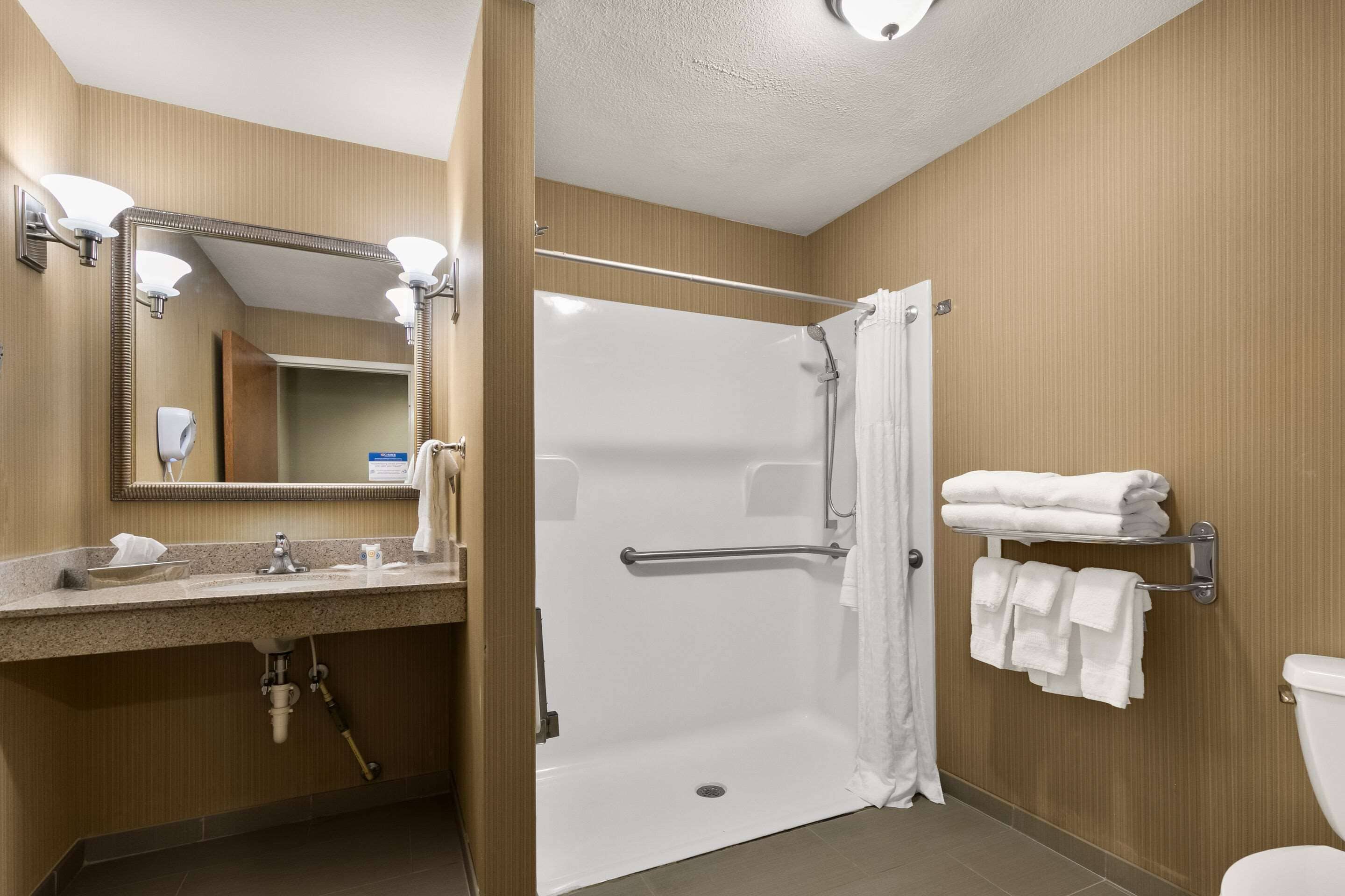 suite, 1 king bed, accessible, non smoking | bathroom | combined shower/bathtub, hair dryer, towels, soap