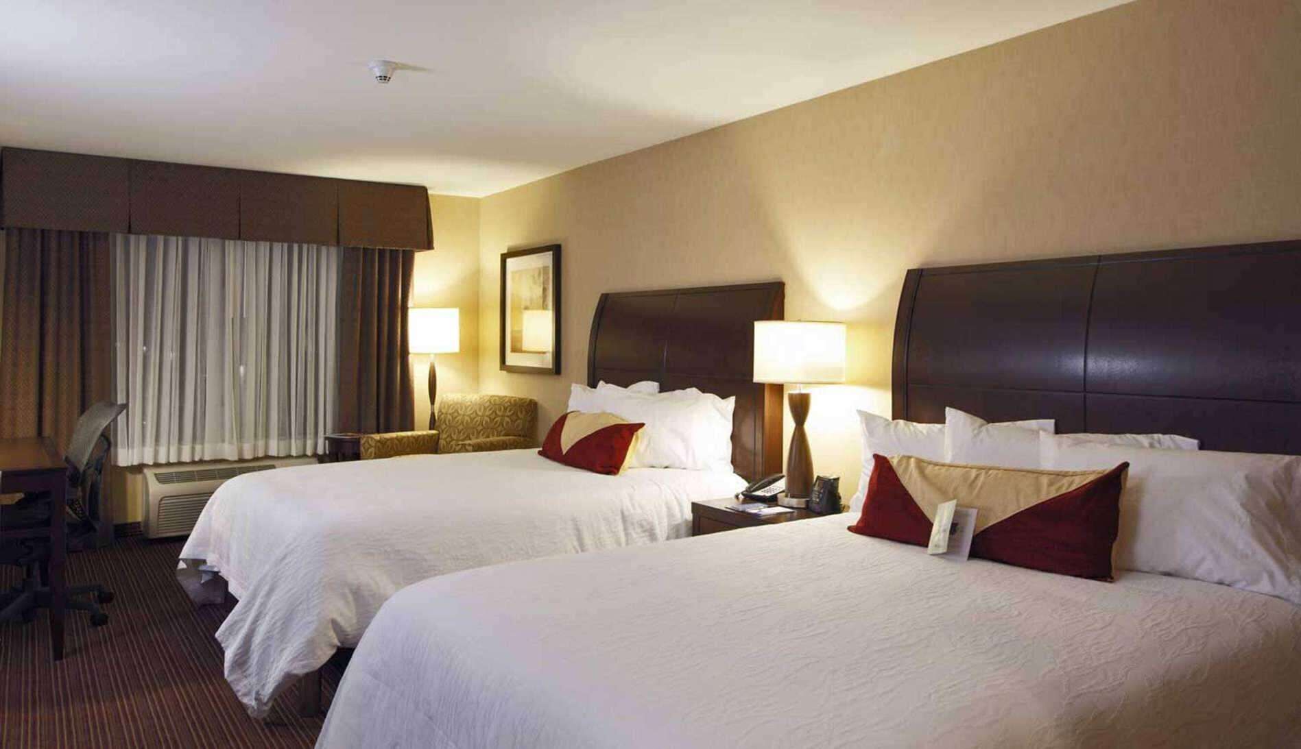 Hypo-allergenic bedding, down duvets, desk, laptop workspace