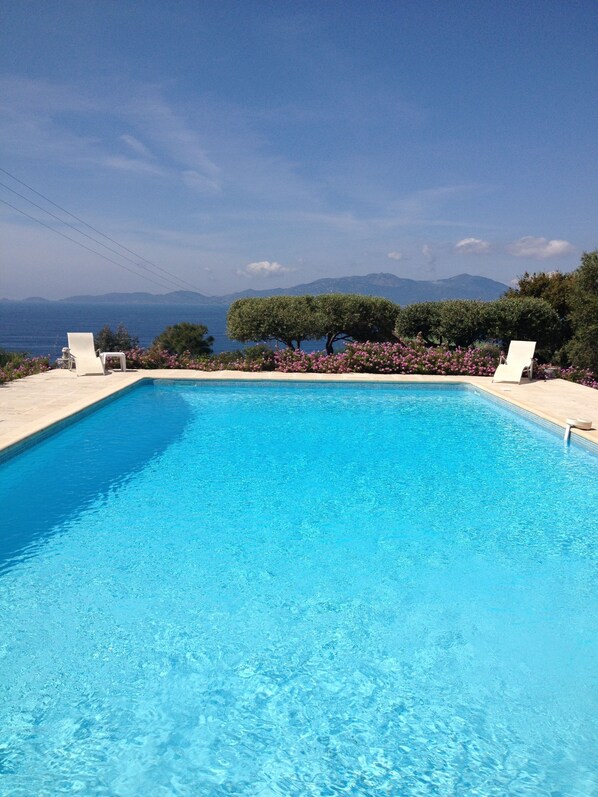 Outdoor pool, open 8 AM to 9 PM, sun loungers