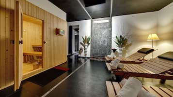 Relax on a wooden bench amidst a calming atmosphere, surrounded by a stone wall and lush greenery.