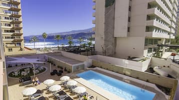Outdoor pool, open 10 AM to 6 PM, pool loungers