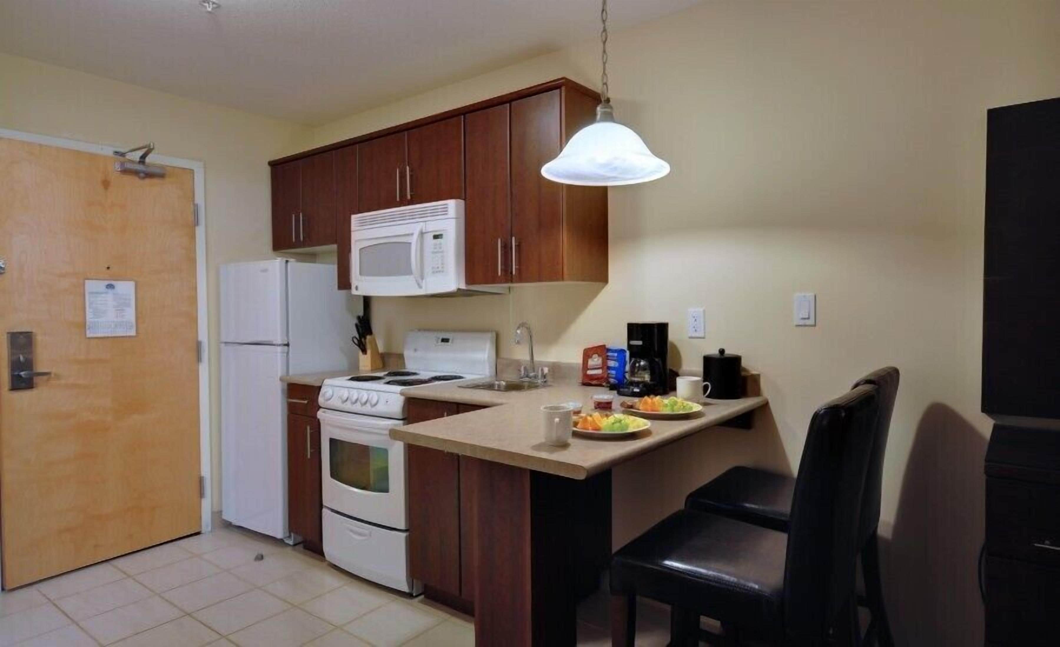 suite, 1 king bed, kitchen | private kitchen | fridge, microwave, coffee/tea maker