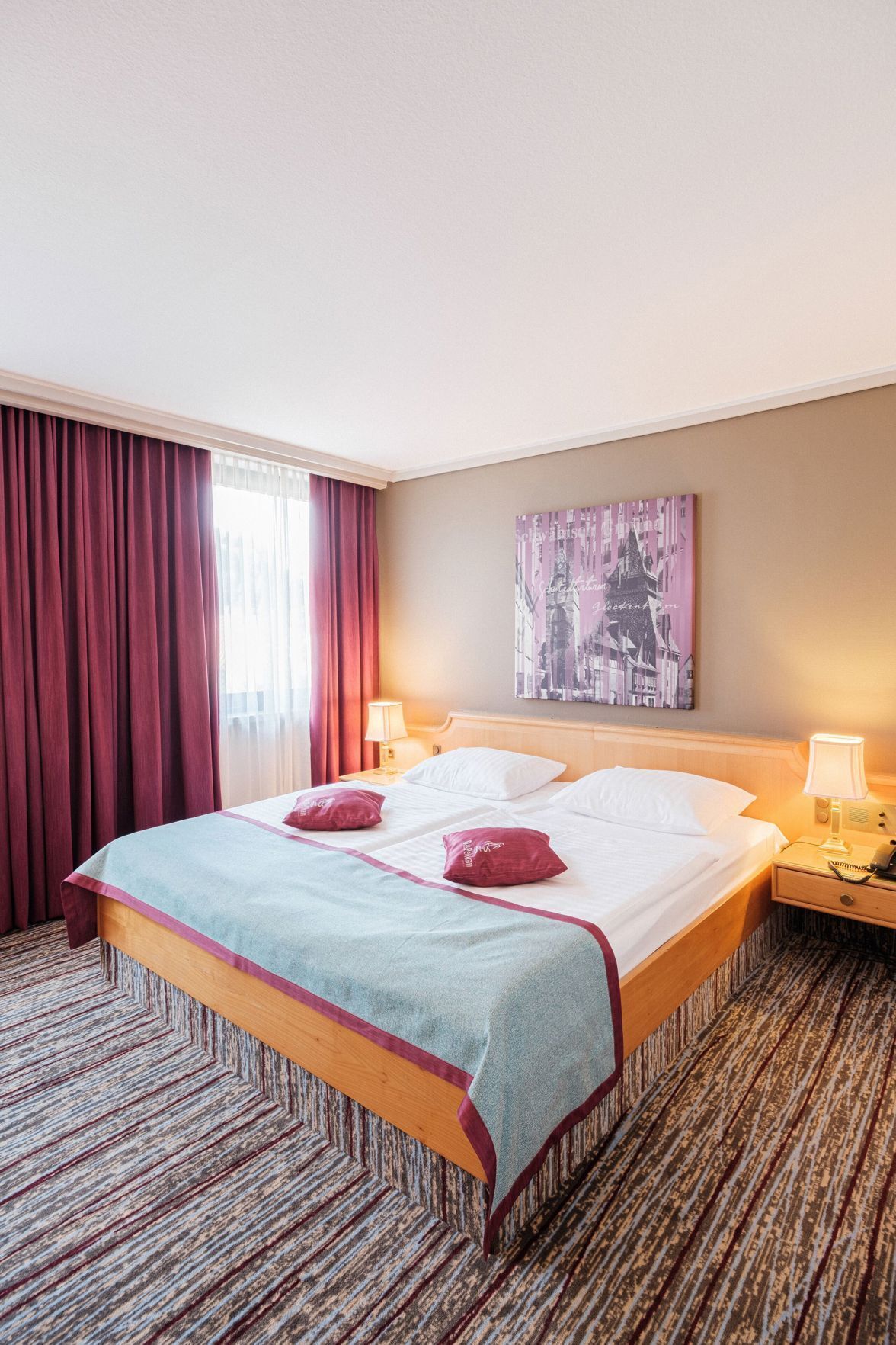 Hypo-allergenic bedding, down duvets, minibar, desk