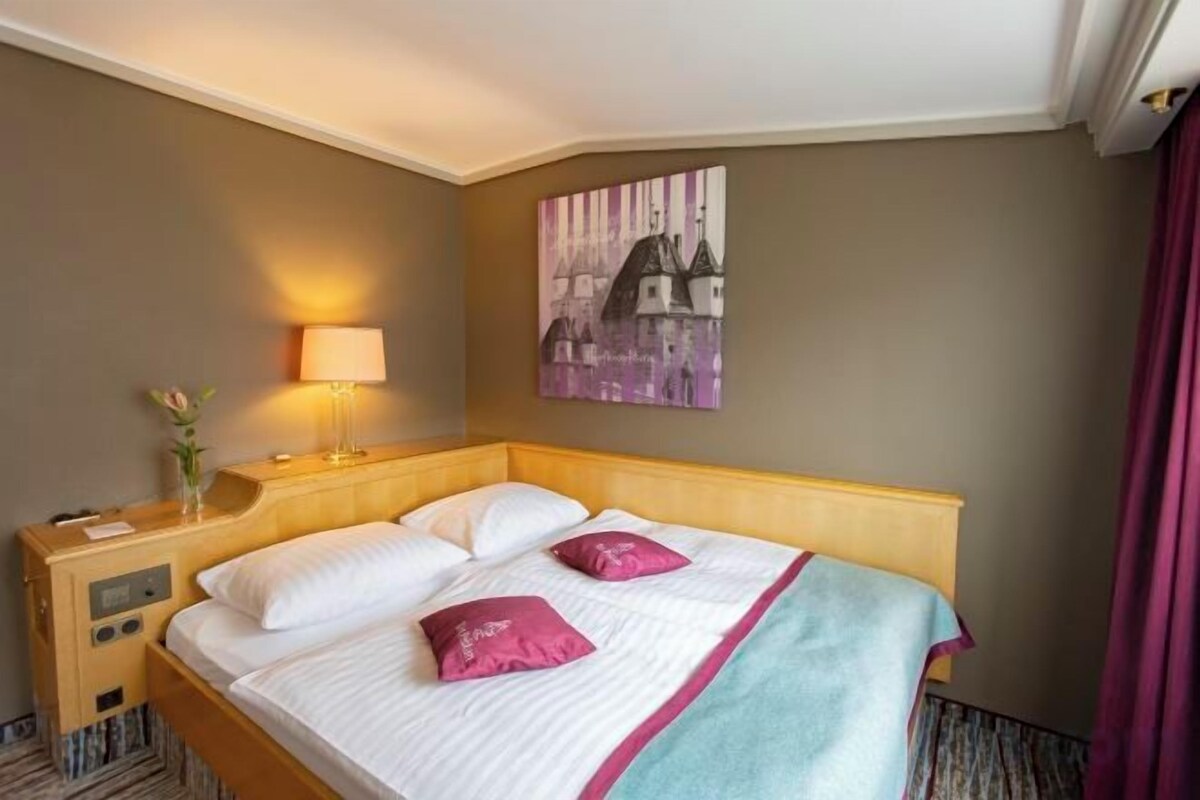 Hypo-allergenic bedding, down duvets, minibar, desk