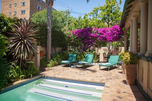 Outdoor pool, open 7:00 AM to 9:00 PM, pool umbrellas, pool loungers