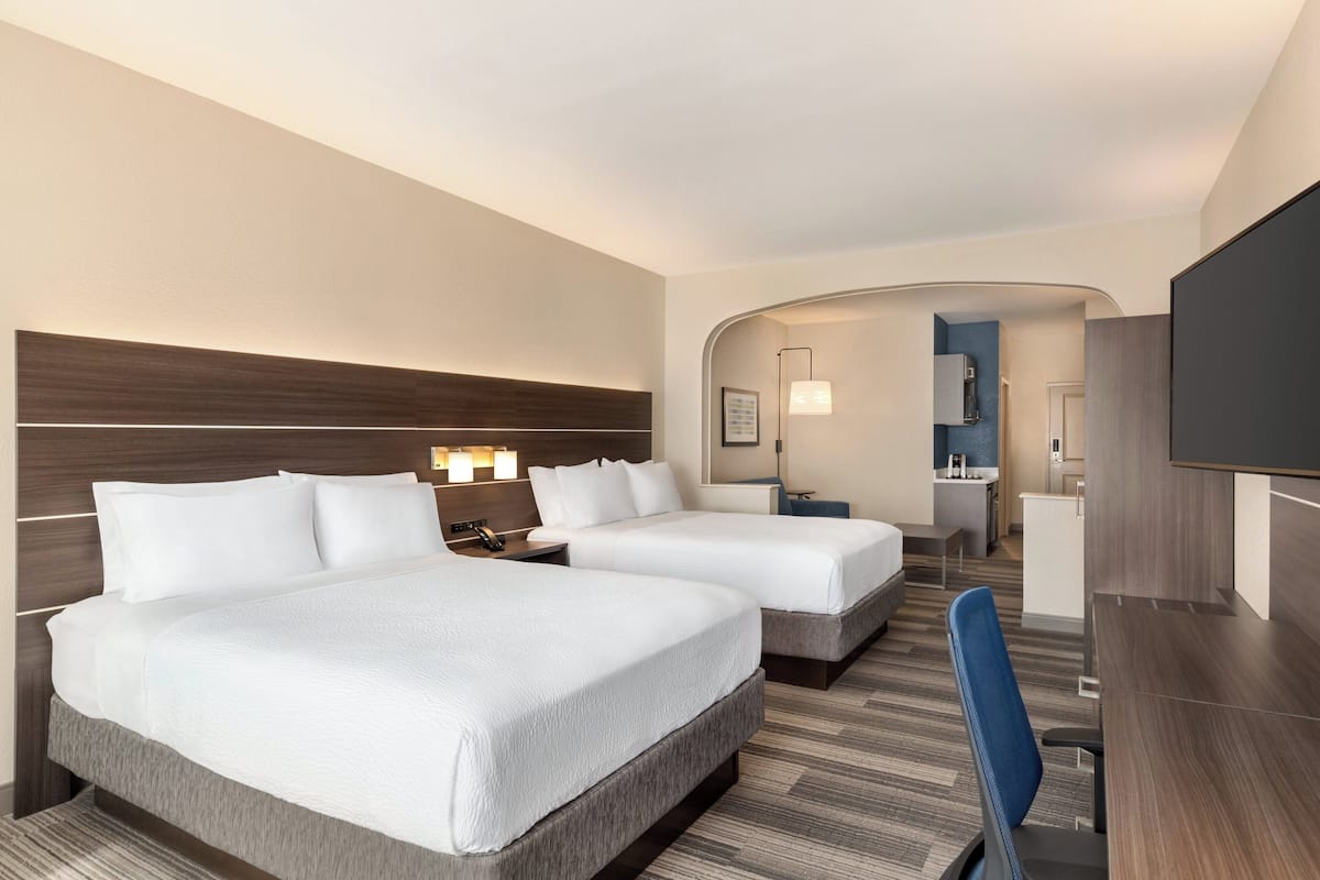Premium bedding, desk, laptop workspace, blackout curtains