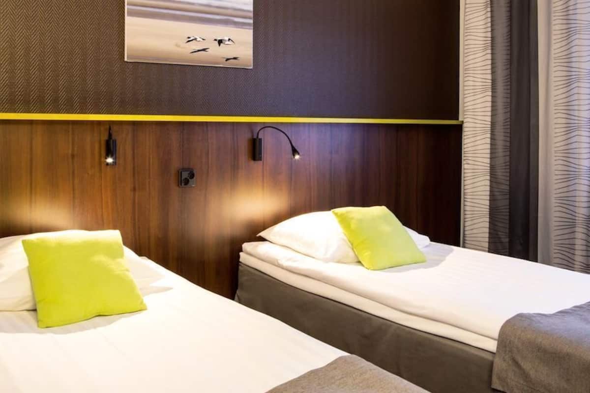 twin standard plus | premium bedding, desk, blackout curtains, soundproofing