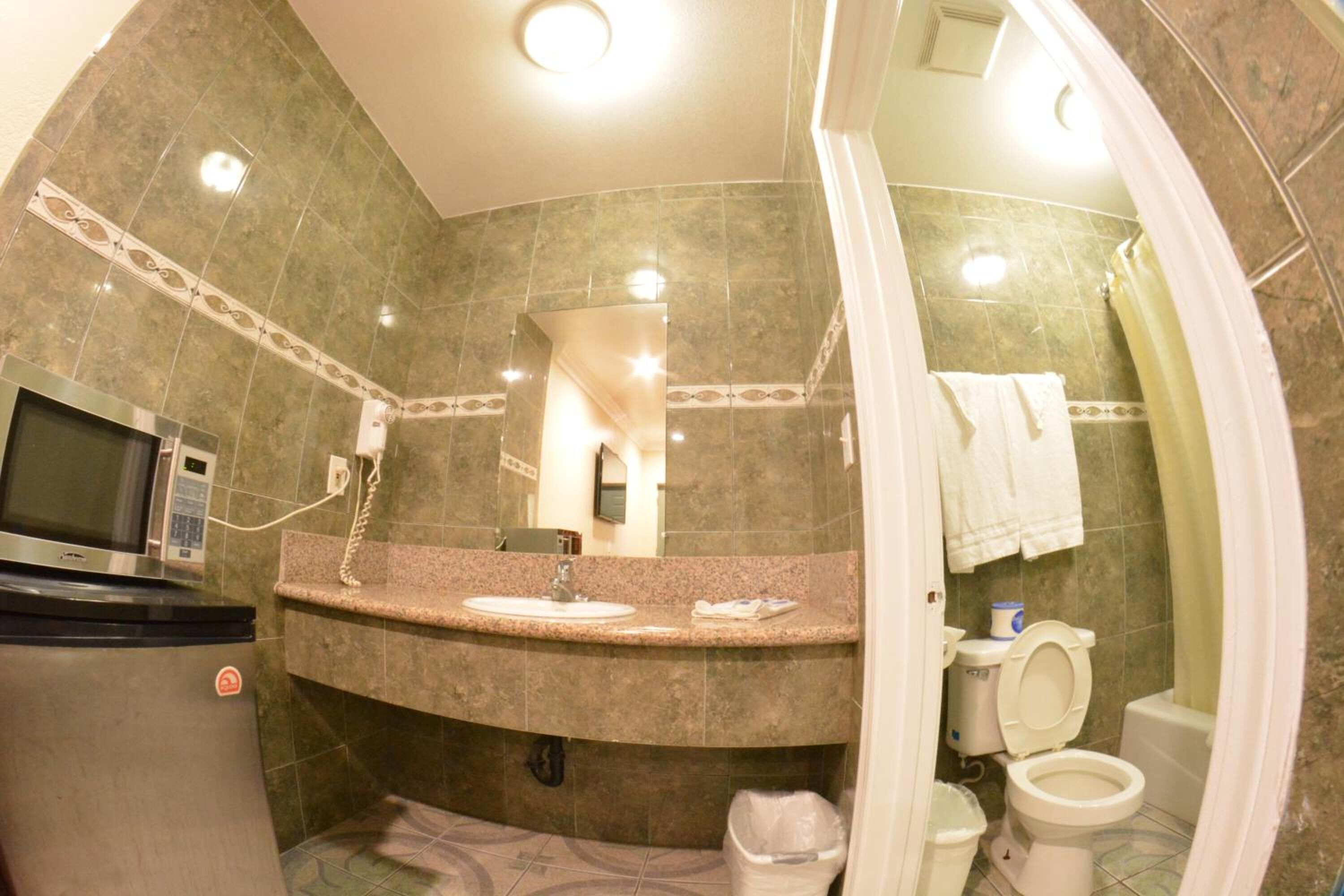 Bathtub, designer toiletries, hair dryer, heated floors