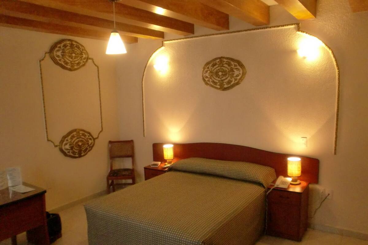 Colonial Queen Bedroom | Down duvets, desk, iron/ironing board (on request), free WiFi