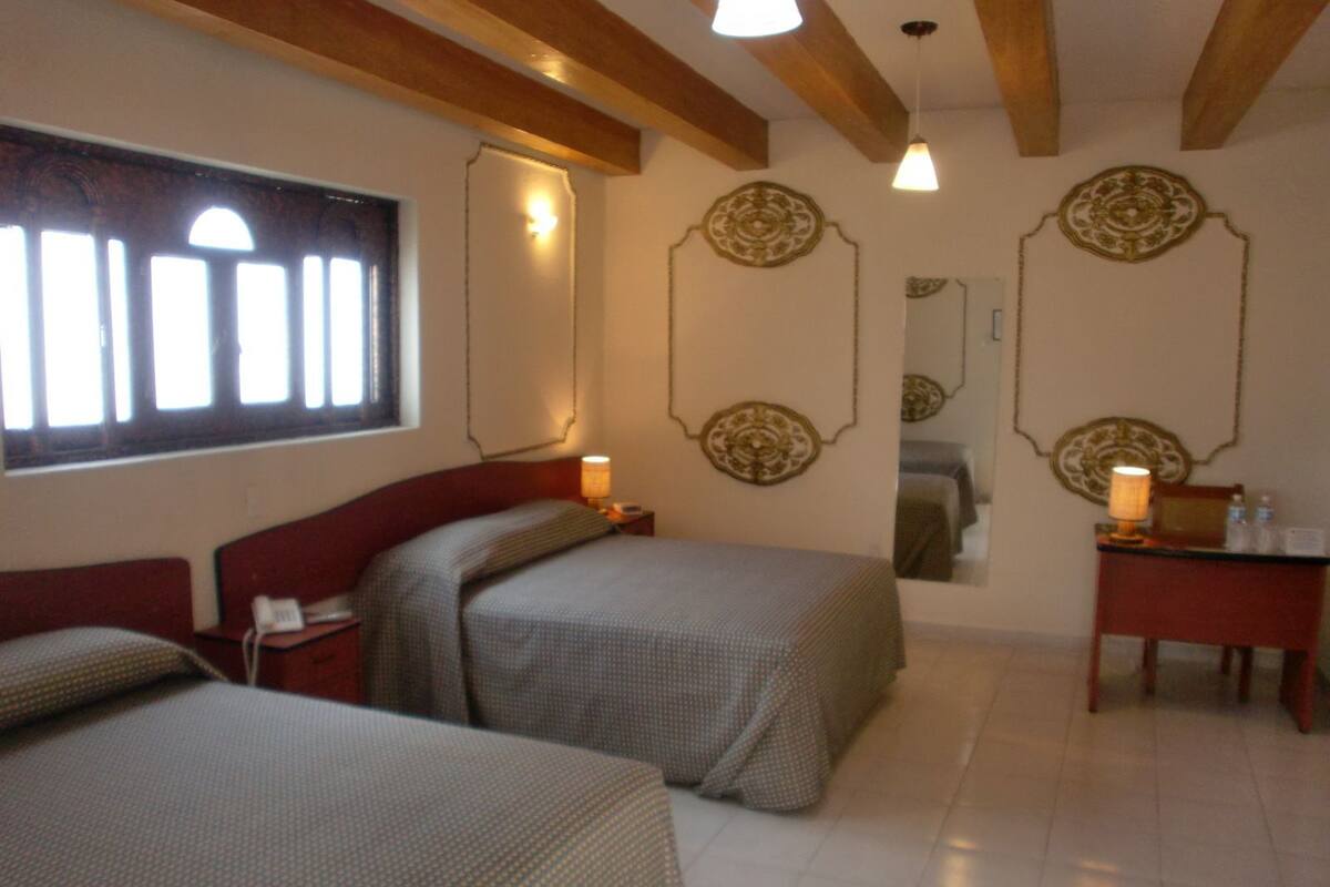 Colonial Double Bedroom | Down duvets, desk, iron/ironing board (on request), free WiFi