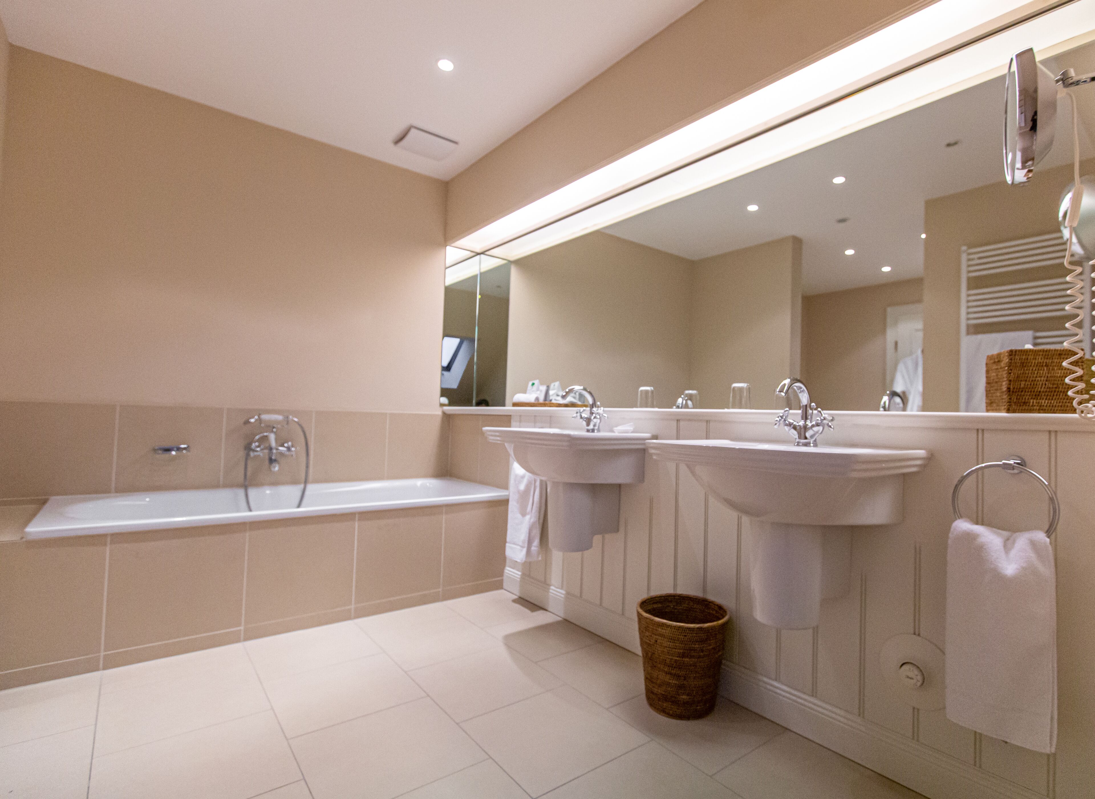 deluxe suite | bathroom | free toiletries, hair dryer, slippers, towels