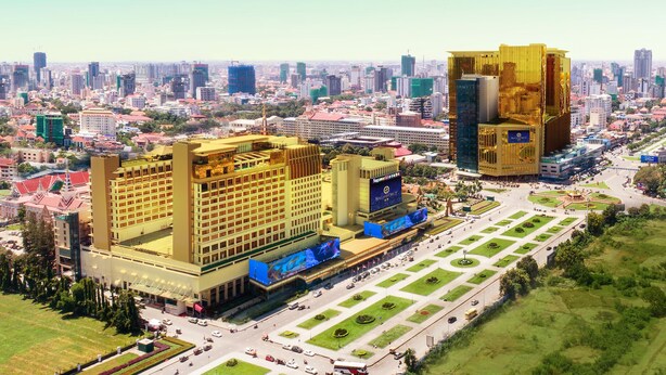 A large hotel with multiple floors, a central courtyard, and a prominent billboard. - NagaWorld Hotel & Entertainment Complex (Phnom Penh)