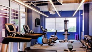 A gym with treadmills, elliptical machines, and weight benches. - Aloft by Marriott Arundel Mills BWI Airport (Hanover)