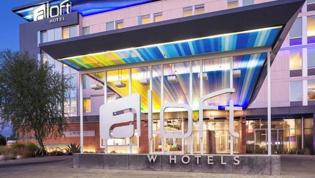 A modern hotel building with a prominent 'eHotel' sign and 'W Hotels' branding. - Aloft by Marriott Tempe (Tempe)