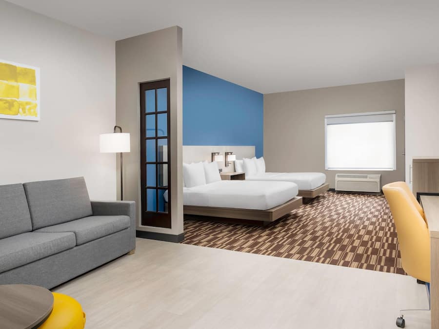 Suite, Multiple Beds, Accessible, Non Smoking | Pillowtop beds, desk, laptop workspace, iron/ironing board